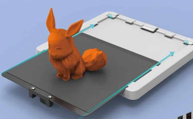 Flexible print plate sliding out with a printed orange model on it